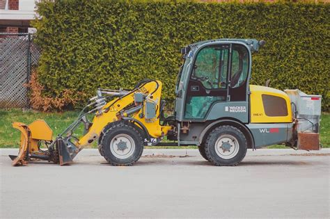 mini excavator and tlb|excavator vs tlb attachment.